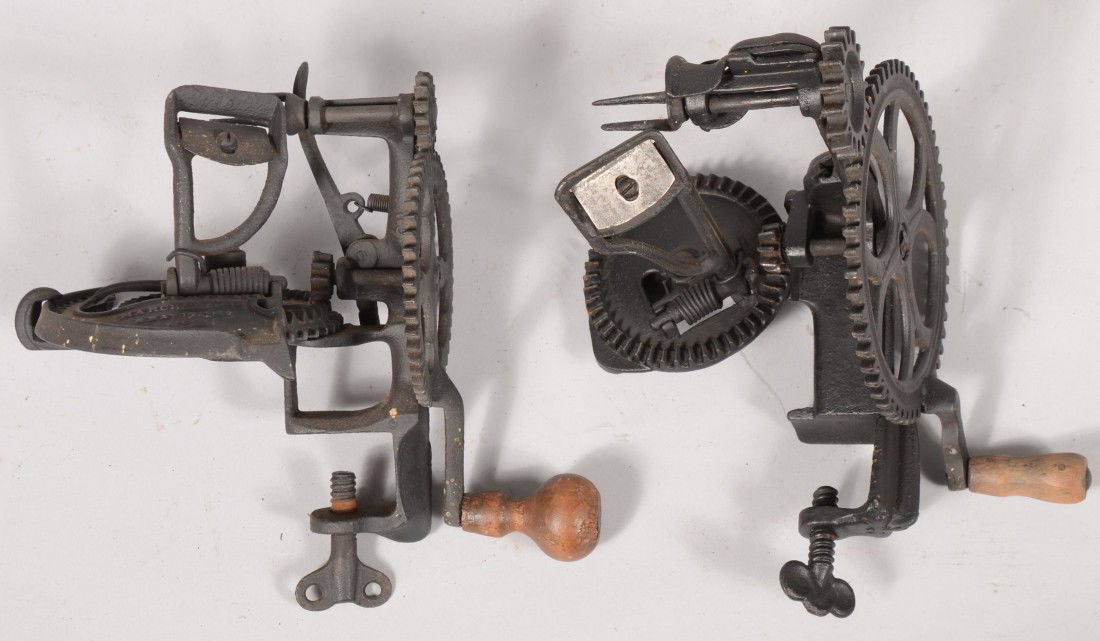 Two Cast Iron Mechanical Apple Peelers. One marked: Two Cast Iron Mechanical Apple Peelers. One marked: "Harbster Bro's & Co., Patd. Mar. 2, 1869." 8 1/2"h., and another marked: "Baldwin, No.4." 8"h.
