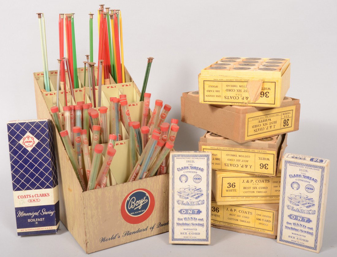 Sewing Supplies. Five dozen large spools of "J&P C: Sewing Supplies. Five dozen large spools of "J&P Coats Best Six Cord Cotton Thread" in their boxes. Three dozen small spools of machine and hand sewing thread in three boxes. A sheet metal "Boye" bran