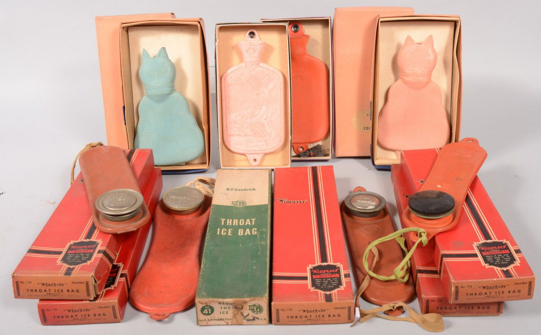 Rubber Products. Ten "Throat Ice Bags." Six in ori: Rubber Products. Ten "Throat Ice Bags." Six in original boxes marked as such by "Wearever" along with four of same not in boxes. 15"l. with and 12"l. without. Four boxed "Seiberling, Kitty Kat, Comfor
