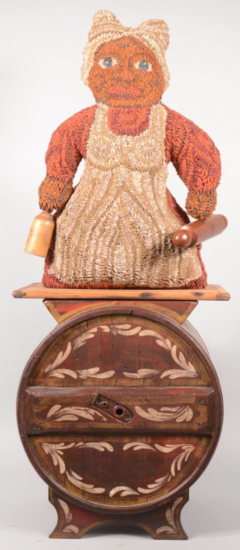 Kathy Graybill Latch Hooked Mammy Doll Mounted on: Kathy Graybill Latch Hooked Mammy Doll Mounted on a Painted Butter Churn. Front side of doll made of hooked loops of fabric with reddish brown dress tan apron and headdress and bearing a wooden masher
