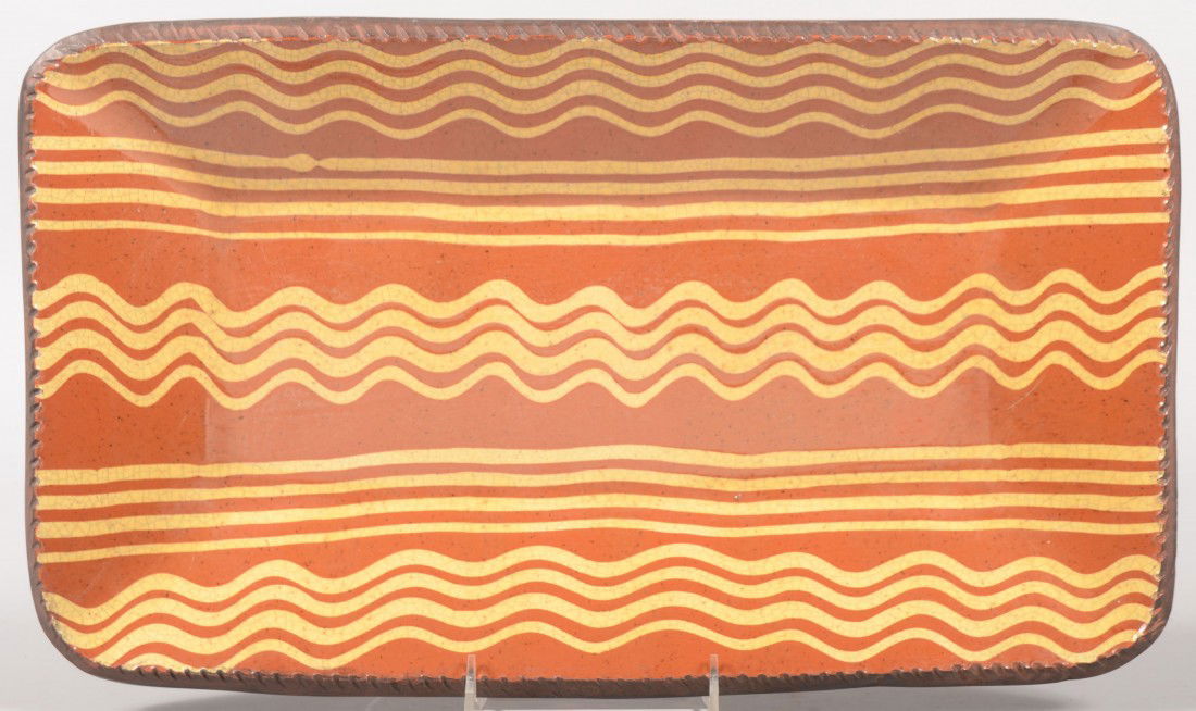 Rectangle Redware Platter by Turtle Creek. Coggle: Rectangle Redware Platter by Turtle Creek. Coggle rim. Face decorated with five sets of four parallel slip lines. 17 1/2"l. X 10 1/4"w.