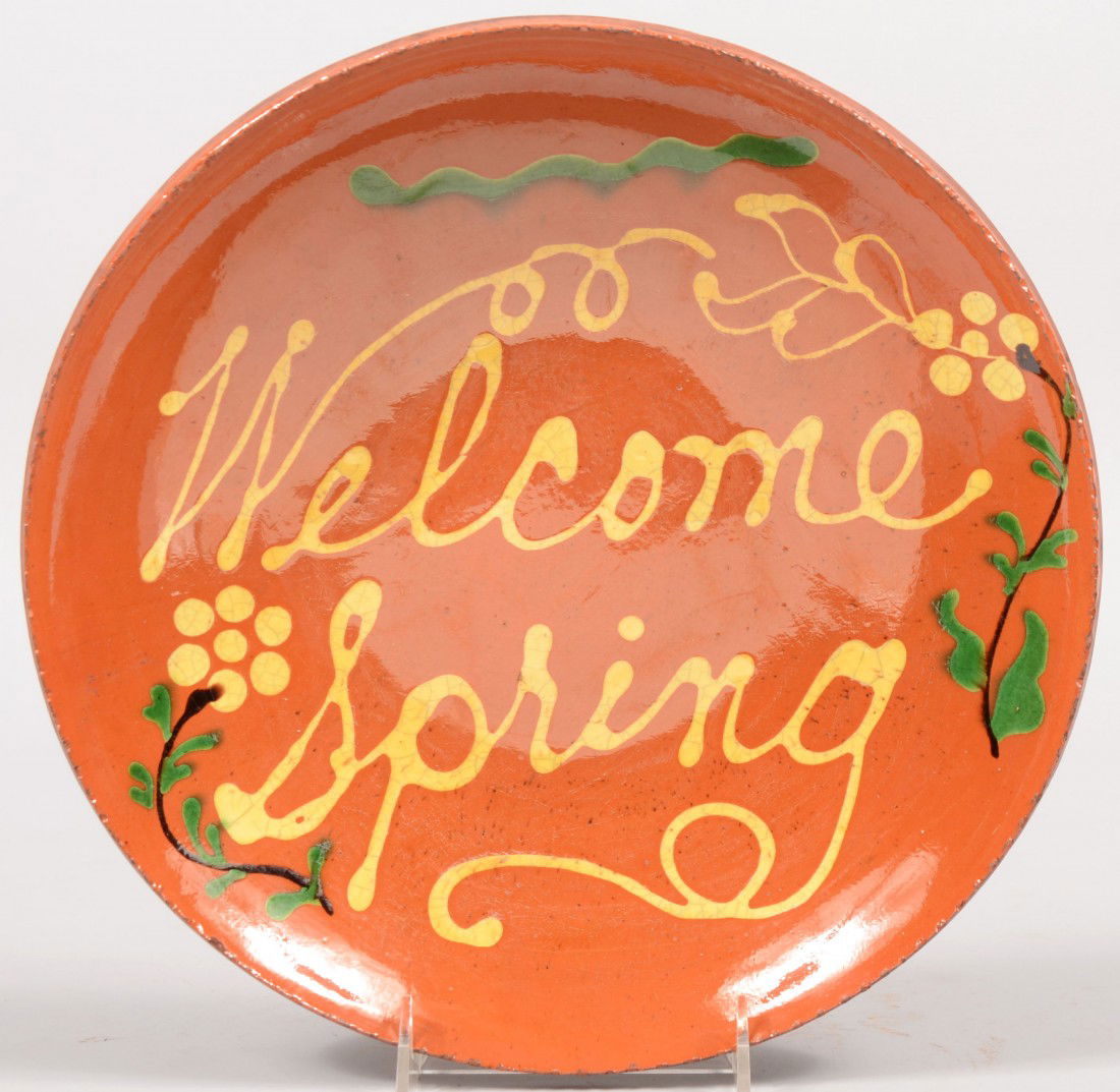 Turtle Creek Redware Dish with Inscription. Marked: Turtle Creek Redware Dish with Inscription. Marked: "Welcome Spring" flanked by flowers. Coggle rim. 11 5/8"dia.