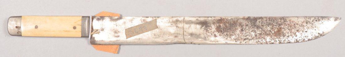 Large straight single edged knife having a 13" stra: Large straight single edged knife having a 13" straight blade with forged splice at mid-point, ivory color grips, and pourous cast mountings. Attached is a partial tag reading "All that remains of a w
