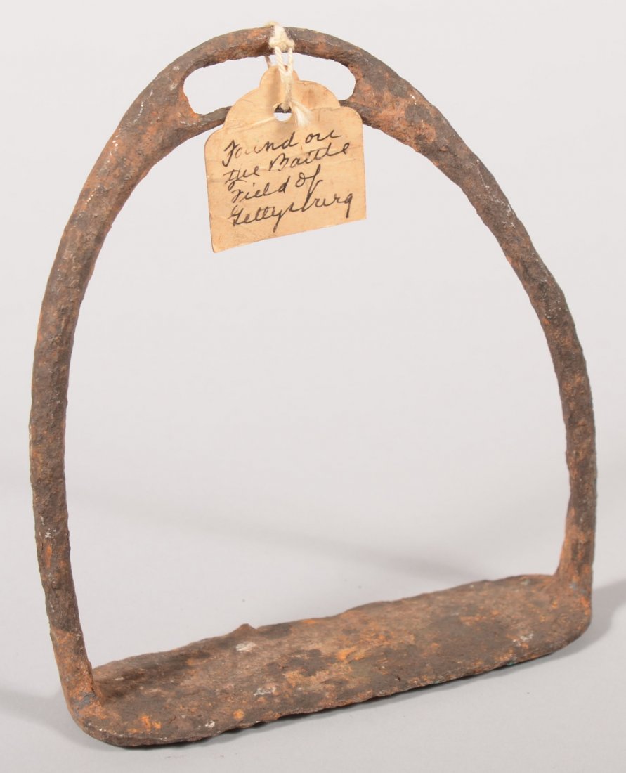 Iron solid tread stirrup having a tag reading "Fou: Iron solid tread stirrup having a tag reading "Found on the Battle Field of Gettysburg". Deeply pitted.