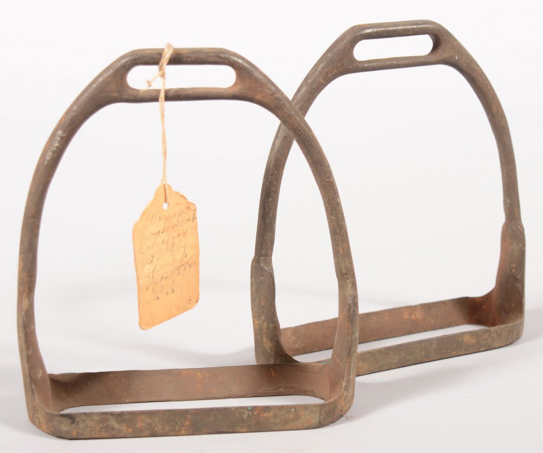 Pair of iron stirrups stamped on the bottom "U.S./: Pair of iron stirrups stamped on the bottom "U.S./A.G.S & BROS."