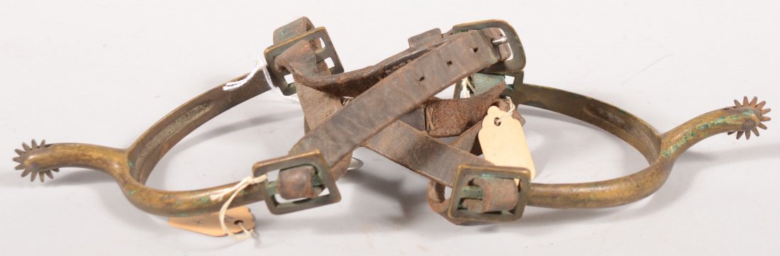 Pair of 19th century brass Cavalry spurs with 3/4": Pair of 19th century brass Cavalry spurs with 3/4" steel rowels and leather straps having a brass buckle.