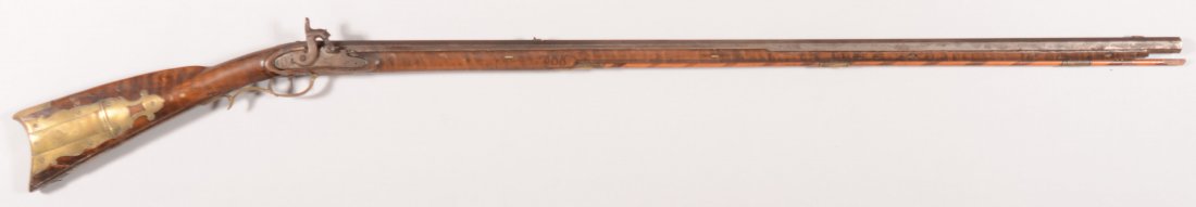 Signed full stock Kentucky rifle having a 50 calib: Signed full stock Kentucky rifle having a 50 caliber 43" octagon barrel with a partial signature on the top, a John Walker marked lock converted to percussion, floral engraved toeplate, engraved patch