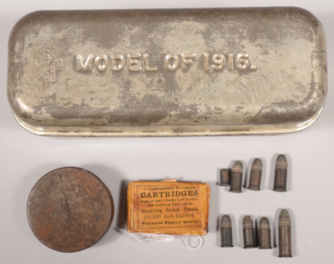 Model of 1916 meat can containing an opened packe: Model of 1916 meat can containing an opened packet of six 31 caliber combustible carttridges made by American Powder Co plus some rimfire cartridges and a tin of musket caps.