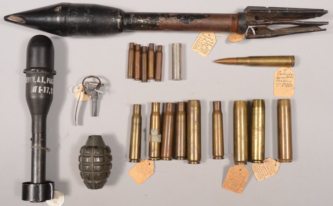 Lot of WW2 inert ordnance incl a practice bazooka : Lot of WW2 inert ordnance incl a practice bazooka round, a practice rifle grande, a pineapple grenade, plus 50 caliber and 20mm empty shells.