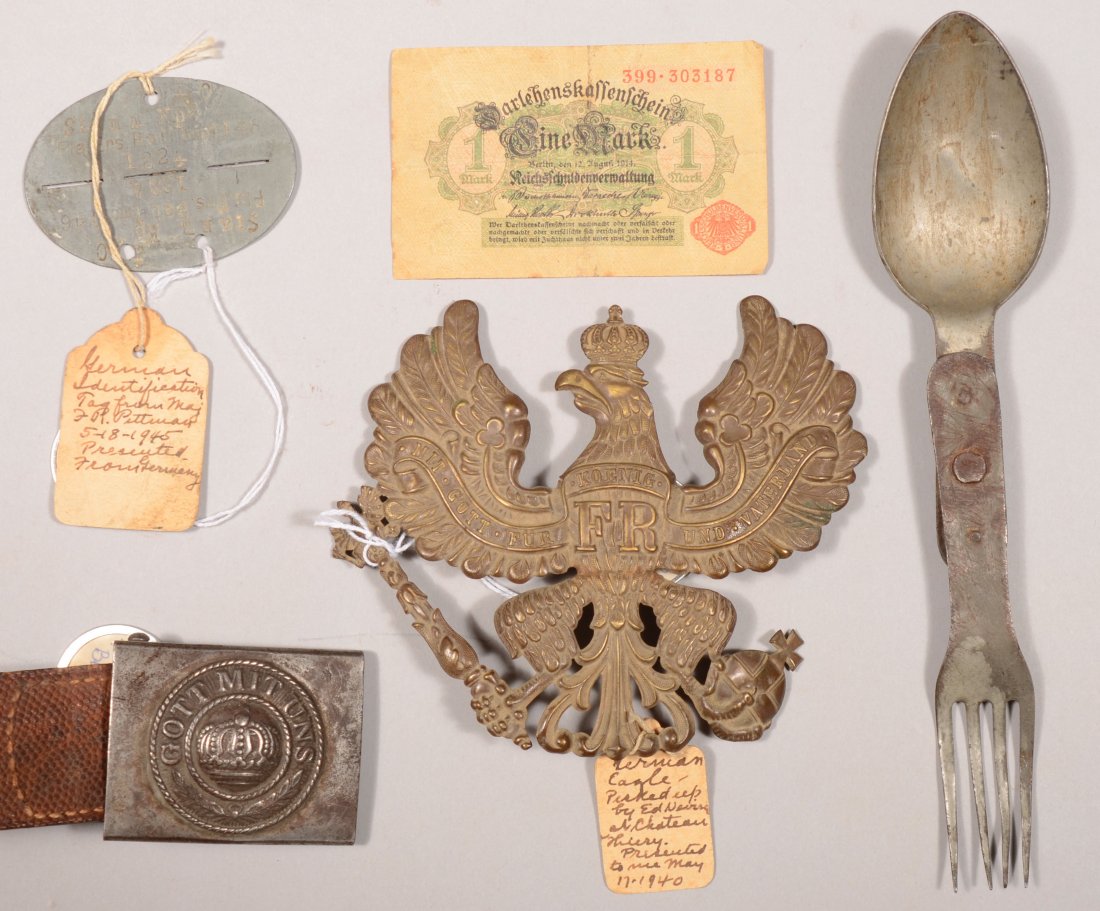 Lot of Imperial German items: an oval 2-part gray : Lot of Imperial German items: an oval 2-part gray metal identification tag, a Gott Mit Uns belt buckle with leather tab, a Prussian front plate for a spike helmet, a combination fork and spoon, and a 
