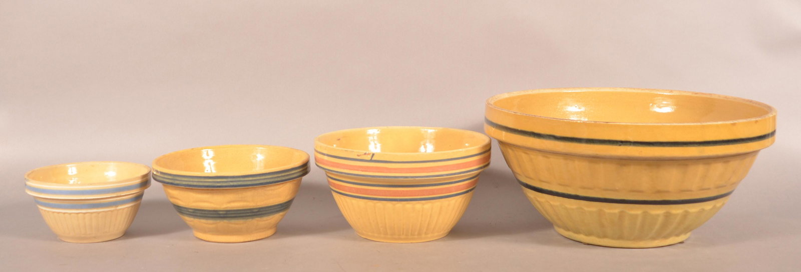 Four Various Antique Yellowware Mixing Bowls. (1 of 2)