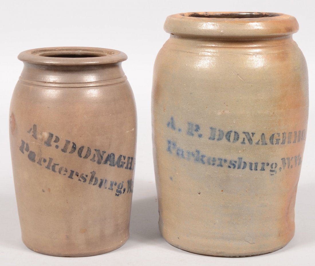 Two Stencil Marked Stoneware Canning Jars. Both mar: Two Stencil Marked Stoneware Canning Jars. Both marked: "A. P. Donaghho, Parkersburg, W. Va." One with low tapered edge rim and two neck lines, 8 1/4"h., along with another with a molded rim, 10"h.