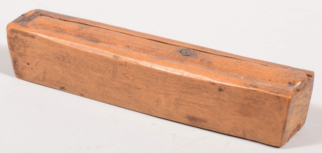 Early 19th Century Walnut Slide-lid Pencil Box. On: Early 19th Century Walnut Slide-lid Pencil Box. One piece carved out base construction with locking slide-lid, signed (illegibly) and dated 1818. 1 5/8"h x 8 3/8"l x 1 5/8"w.