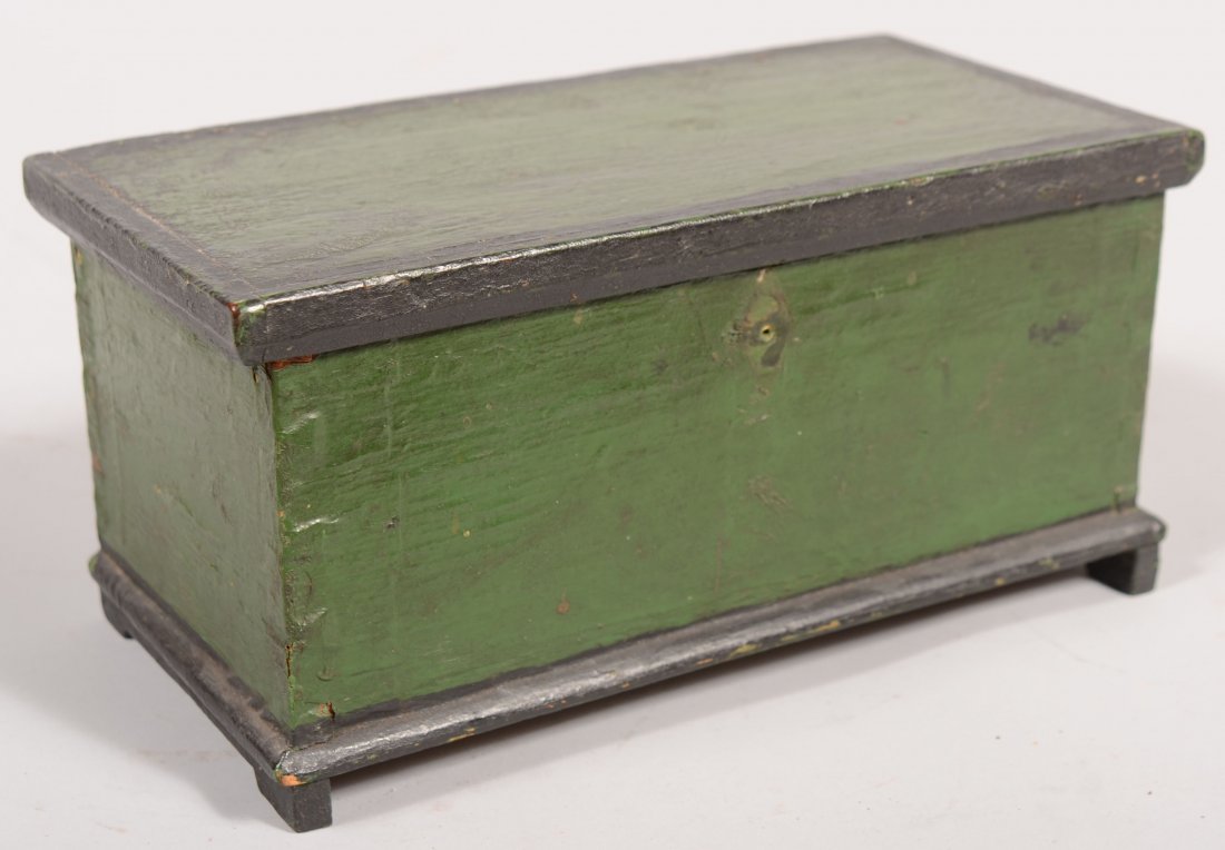 Early 19th Century Softwood Miniature Blanket Ches: Early 19th Century Softwood Miniature Blanket Chest with original green and black trim paint. Molded lid, dovetailed case, molded base with carved bracket feet. Original wire hinges replaced with bras