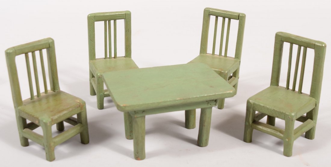 Early 20th Century Folk Art Miniature Table and Fo: Early 20th Century Folk Art Miniature Table and Four Chairs. Hand carved softwood and painted green. Family provenance stated that it was made by their one-armed uncle in the 1920's. Chairs 5" high.
