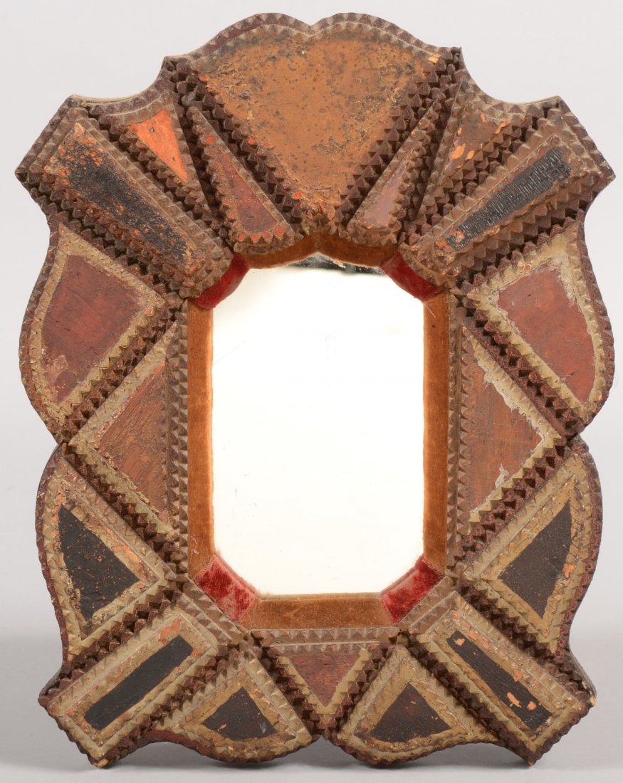 Chip Carved Paint Decorated Tramp Art Mirror Frame: Chip Carved Paint Decorated Tramp Art Mirror Frame. Shaped plank with three layers of chip carved contour pieces in red and black paint outlined with silver radiator paint. Walls of cavity to mirror p
