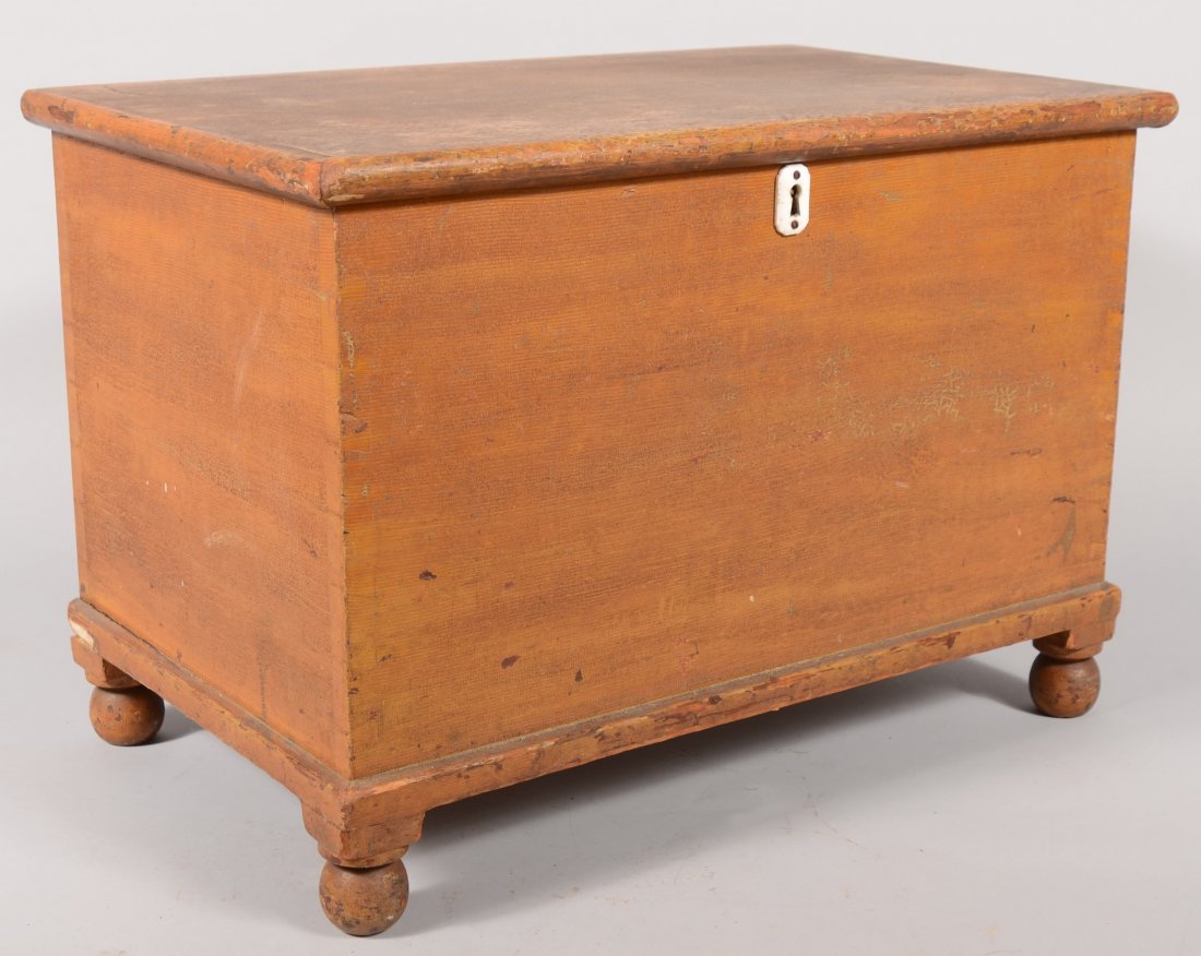 Small Yellow Faux Grained Painted Chest. Dovetaile: Small Yellow Faux Grained Painted Chest. Dovetailed softwood box with hinged lid having a lock and catch, white ceramic keyhole escutcheon and turned ball shaped feet. 17 1/2"h. X 25 1/2"w. X 15 3/4"d