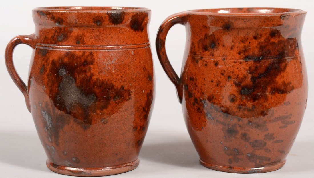 Two Pennsylvania 19th Century Redware Pottery Bulb: Two Pennsylvania 19th Century Redware Pottery Bulbous Form Apple Butter Crocks with applied handles, incised rings and molded bases with mottled glaze. 5 3/4" and 5 7/8" high.