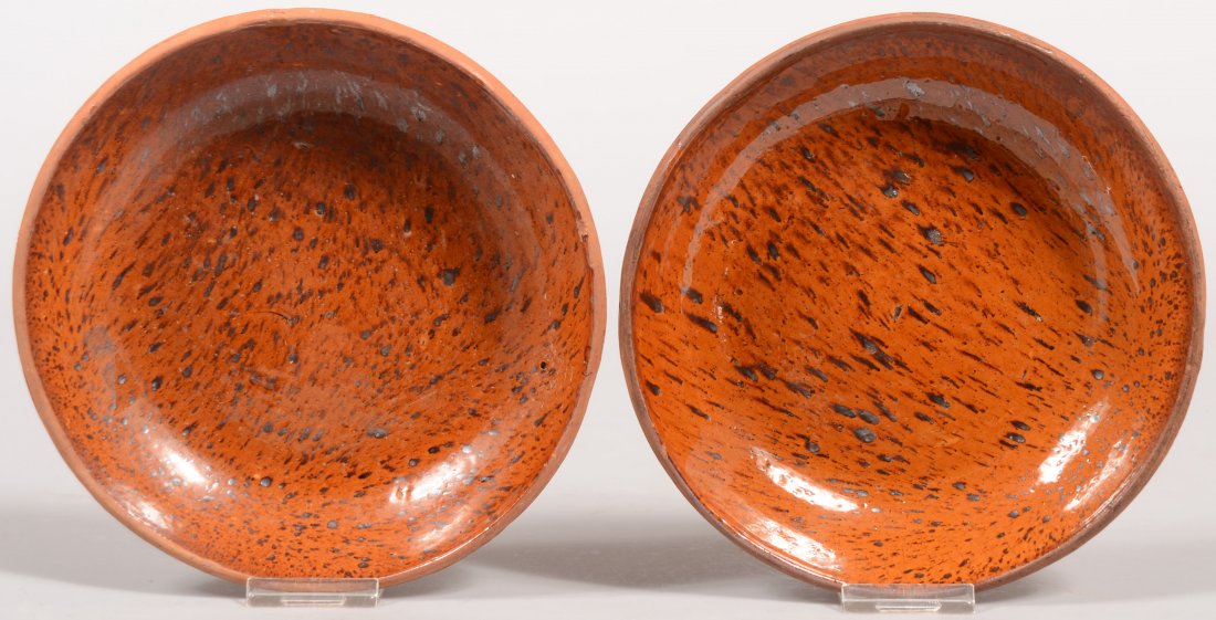 Two Pennsylvania 19th Century Redware Pottery Low: Two Pennsylvania 19th Century Redware Pottery Low Bowls with "tobacco spit" glaze. 7" diam.