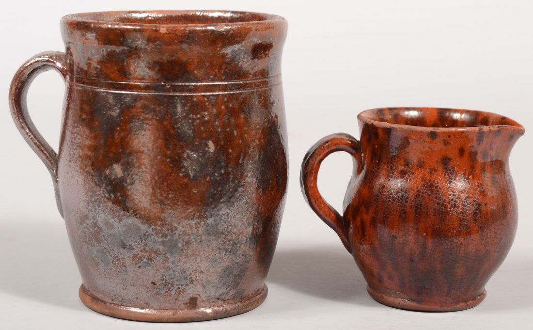 Two Pennsylvania 19th Century Mottled Glazed Redwa: Two Pennsylvania 19th Century Mottled Glazed Redware Pottery Pieces; Apple butter crock, 6"h. and Cream pitcher, 4"h.