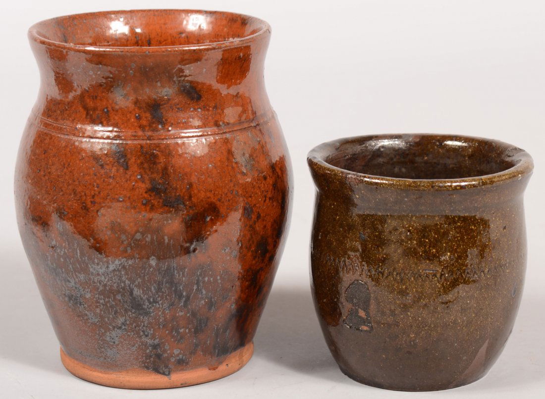 Two Pennsylvania 19th Century Glazed Redware Potte: Two Pennsylvania 19th Century Glazed Redware Pottery Bulbous Form Storage Crocks. 1st having incised zig zag design 3 3/4" and 2nd with incised neck bands, 5 7/8"h.