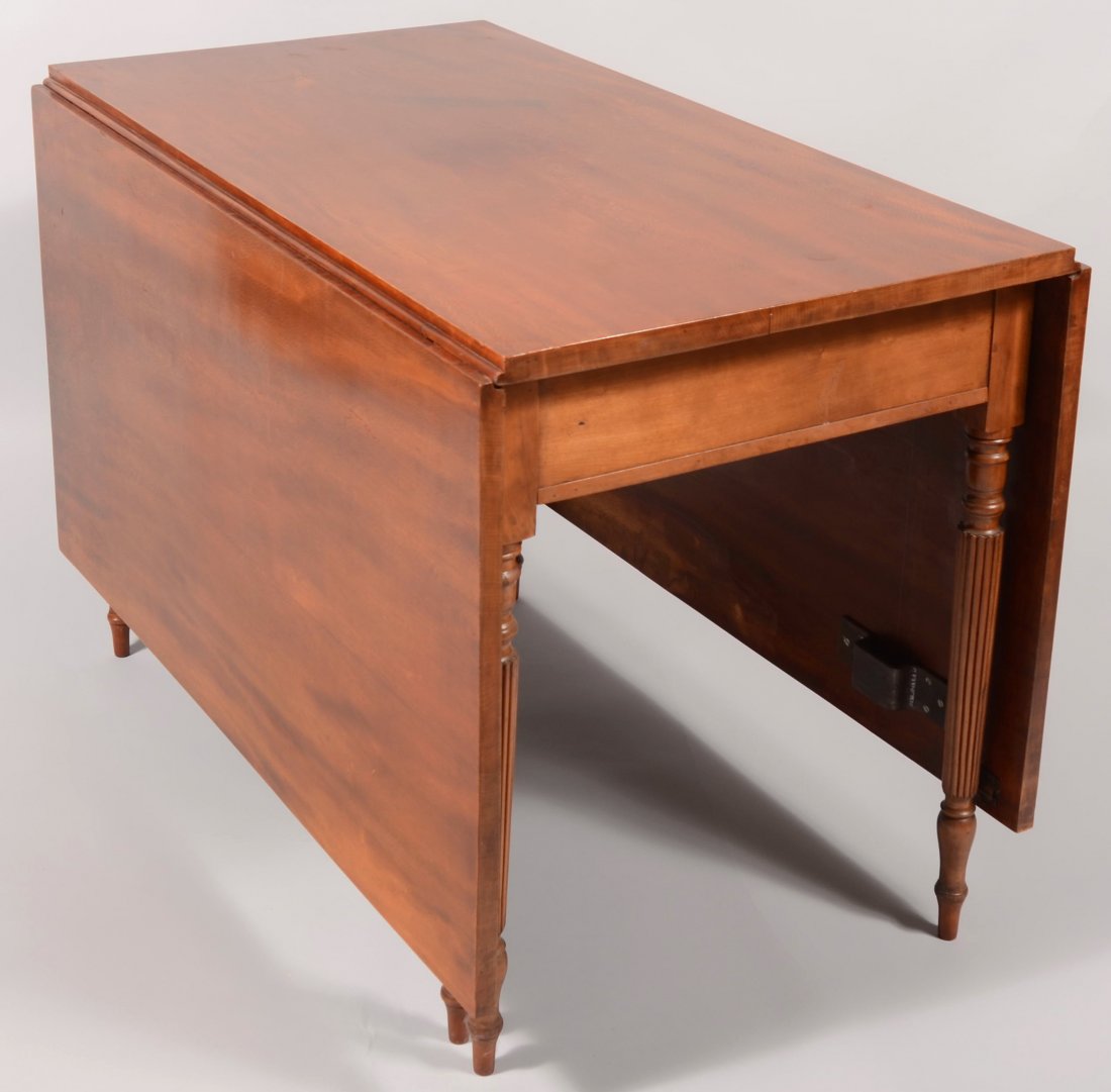 Pennsylvania Sheraton Cherry Drop-leaf Dinning Tab: Pennsylvania Sheraton Cherry Drop-leaf Dinning Table. Six leg gate leg drop leaf table with turned and reeded legs. 29 1/2"h x 24 1/2"w x 43 1/2"d. Each leaf measures 23 1/2". Cleats added to undersid