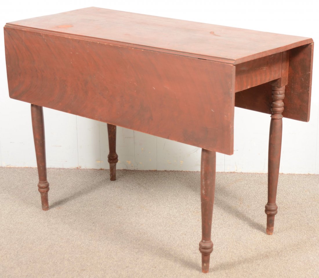 Southeastern Pennsylvania Country Sheraton Grain P: Southeastern Pennsylvania Country Sheraton Grain Paint Decorated Drop-leaf Table. Red ground with black grain decoration, swing out supports and turned legs. 29 1/2"h x 19"w x 41 1/2"d. Each leaf meas