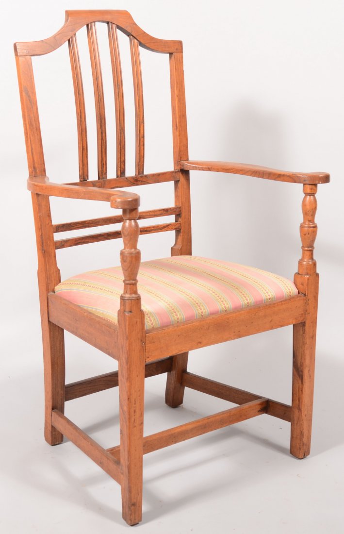 Hepplewhite Mixed-wood Slip Seat Armchair. Shaped : Hepplewhite Mixed-wood Slip Seat Armchair. Shaped crest, banister back, scrolled arms with turned supports and tapered legs stretcher base. Seat height 17 1/2", 41 1/2" high overall.