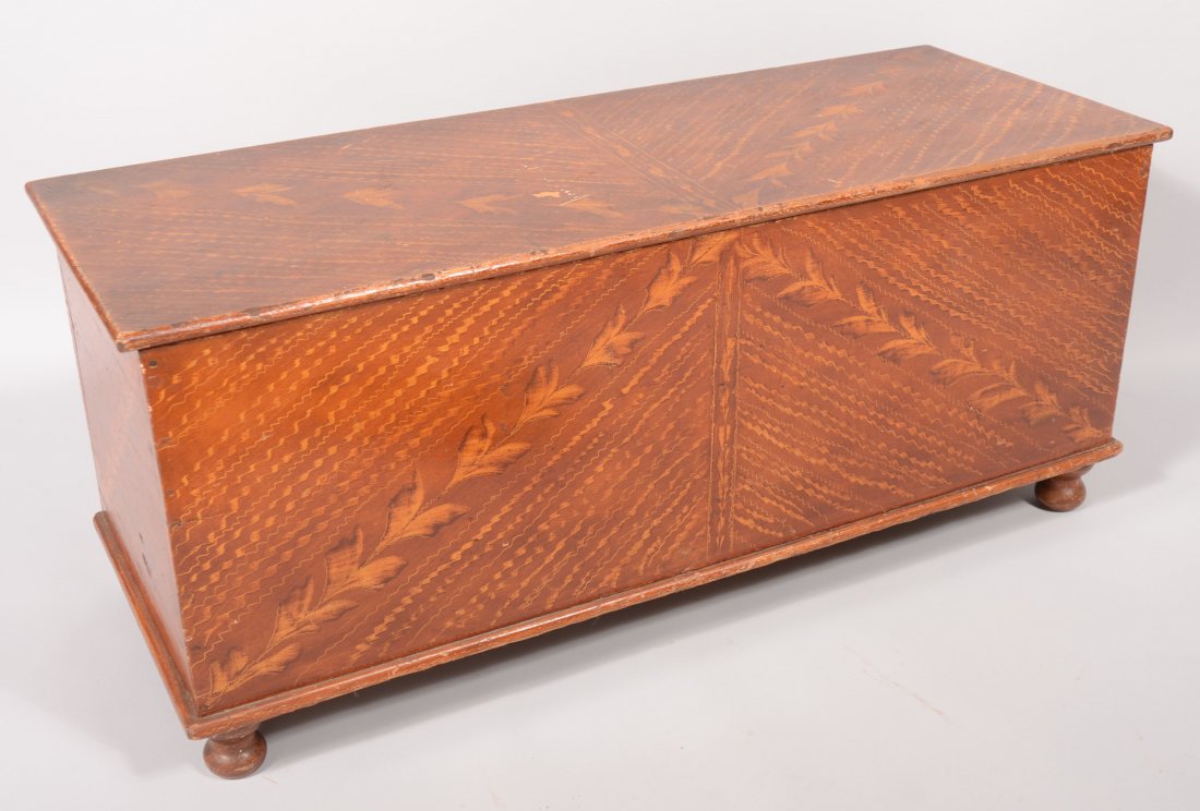 19th Century Softwood Paint Decorated Wood Box. Ta: 19th Century Softwood Paint Decorated Wood Box. Tan and brown leaf and comb grain decoration. Compartmented interior and turned feet. 18"h x 42"w x 16"d.
