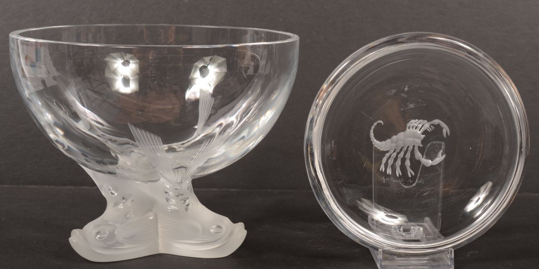 Two Pieces Signed Contemporary Crystal. Frosted an: Two Pieces Signed Contemporary Crystal. Frosted and cut dolphin footed crystal bowl. Signed: "Lalique." 6"h. X 7"dia. Along with a low bowl with a frosted incised scorpion. Signed: "Val St. Lambert." 