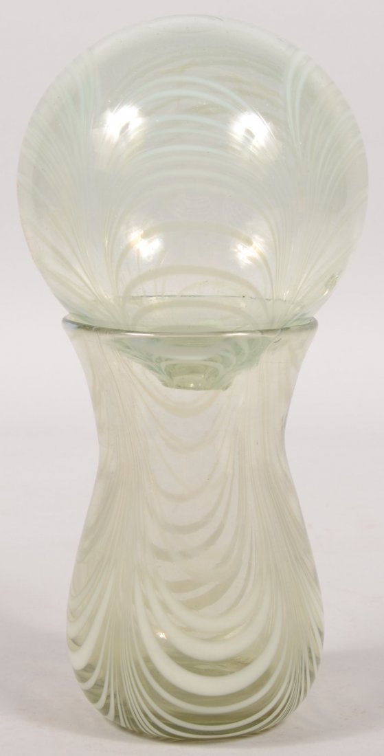 Blown Glass Witches Ball with Stand. Ball and stan: Blown Glass Witches Ball with Stand. Ball and stand are of pale green glass with a series of four panels of concentric white draping lines. Both have broken pontils. Stand has bulbous bottom and flare