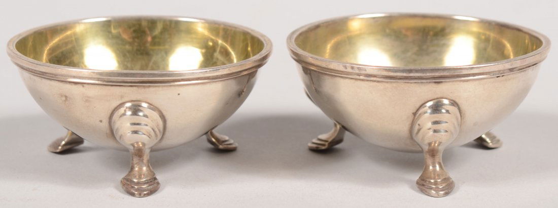 Pair of Silver Plated Salts. Gold flash lined half: Pair of Silver Plated Salts. Gold flash lined half sphere bowls with stepped rim and short crescent shaped legs. Marked on bottom: "Tiffany, Young & Ellis" a pre-1853 mark. 1 3/8"h. X 2 13/16"dia.