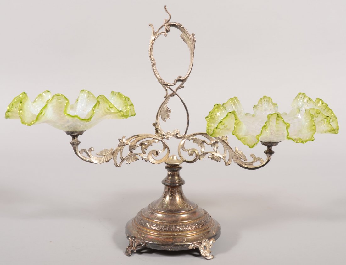 A Double Fancy Dish Silver Plated Epergne. Colorle: A Double Fancy Dish Silver Plated Epergne. Colorless to clams broth to light green rim, diamond patterned with rippled rim glass dishes secured to a double arm stand with scrolled frame and loop handl