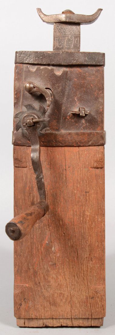 Conestoga Wagon Jack. Wrought iron parts mounted o: Conestoga Wagon Jack. Wrought iron parts mounted onto an oak body, gear crank with wood grip and rack shaft with swivel yoke. All body parts show remnants of original orange paint. Punch decorated sha
