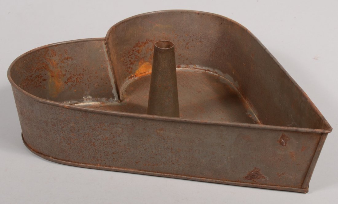Heart Shaped Tinned Sheet Iron Cake Pan. Having a : Heart Shaped Tinned Sheet Iron Cake Pan. Having a conical center vent. 16"h. X 13 3/8"w. X 3 1/2"deep.
