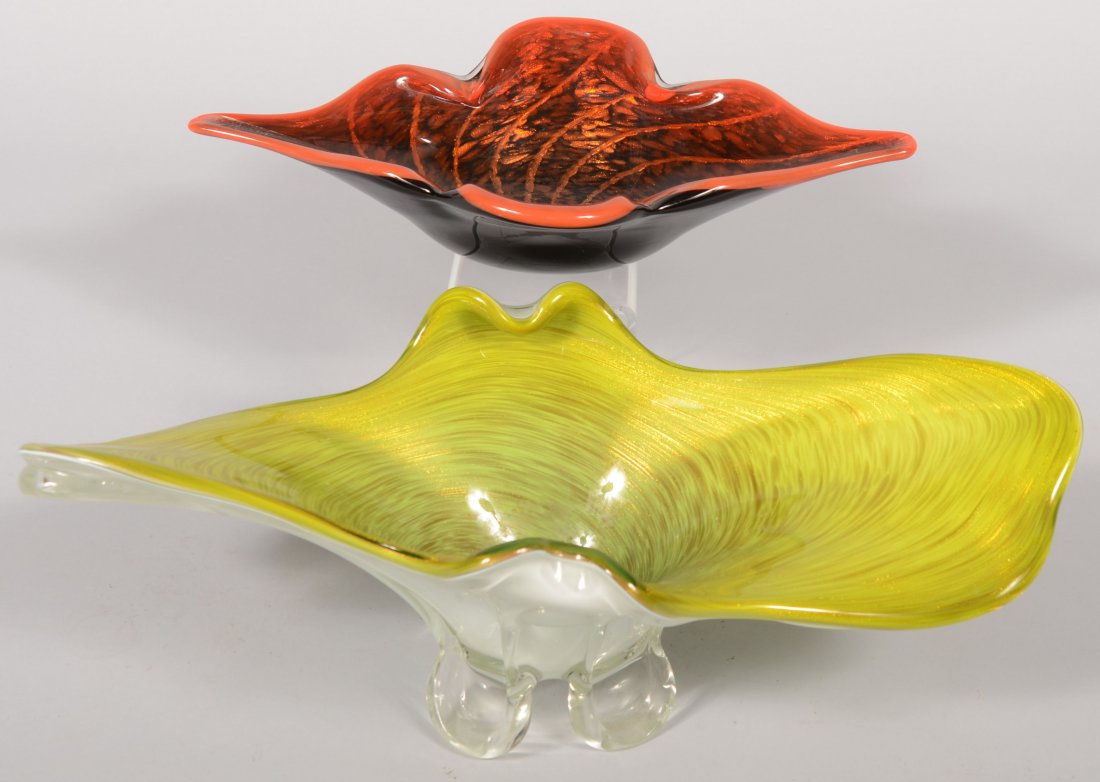 Two Larger Murano Blown Art Glass Dishes. A wide p: Two Larger Murano Blown Art Glass Dishes. A wide pulled rim, black cased dish with orange rim and copper dust spots with swirled radiating lines. 16"w. X 10"d. Along with a wide lobed and flared rim d