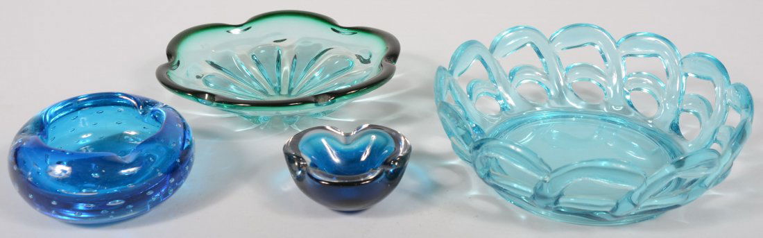 Four Blue Art Glass Bowls. Two Heavy Blown Ashtray: Four Blue Art Glass Bowls. Two Heavy Blown Ashtrays. Larger bowl shape with suspended bubbles and three indents on rim. 6"dia. A small bowl with three indents. 4"dia. A lighter blue scalloped rim dish