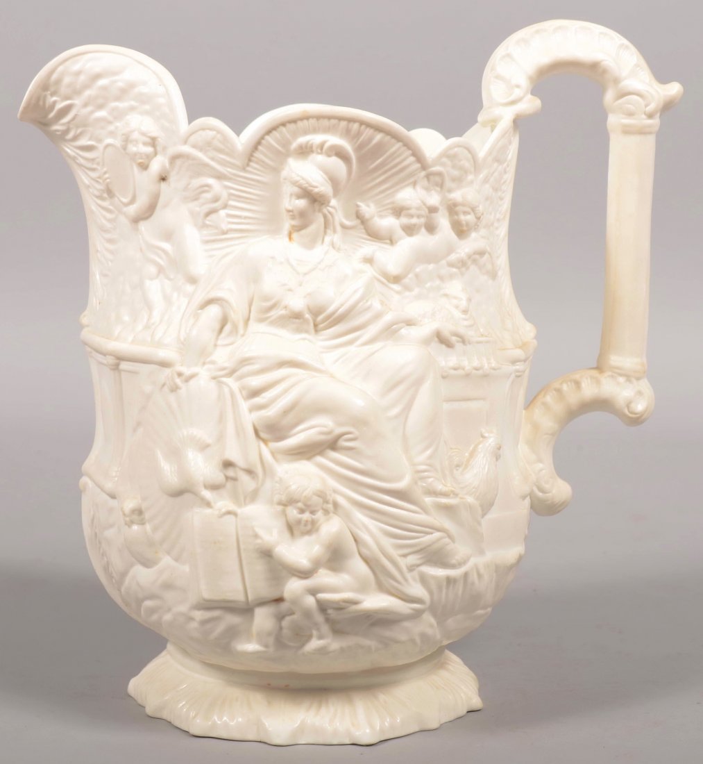 White Parian Pitcher. Neo-classic designs with two: White Parian Pitcher. Neo-classic designs with two Goddesses surrounded by eight cherubs. Aesthetic revival style handle, scalloped rim and raised foot. 10 3/8"h.