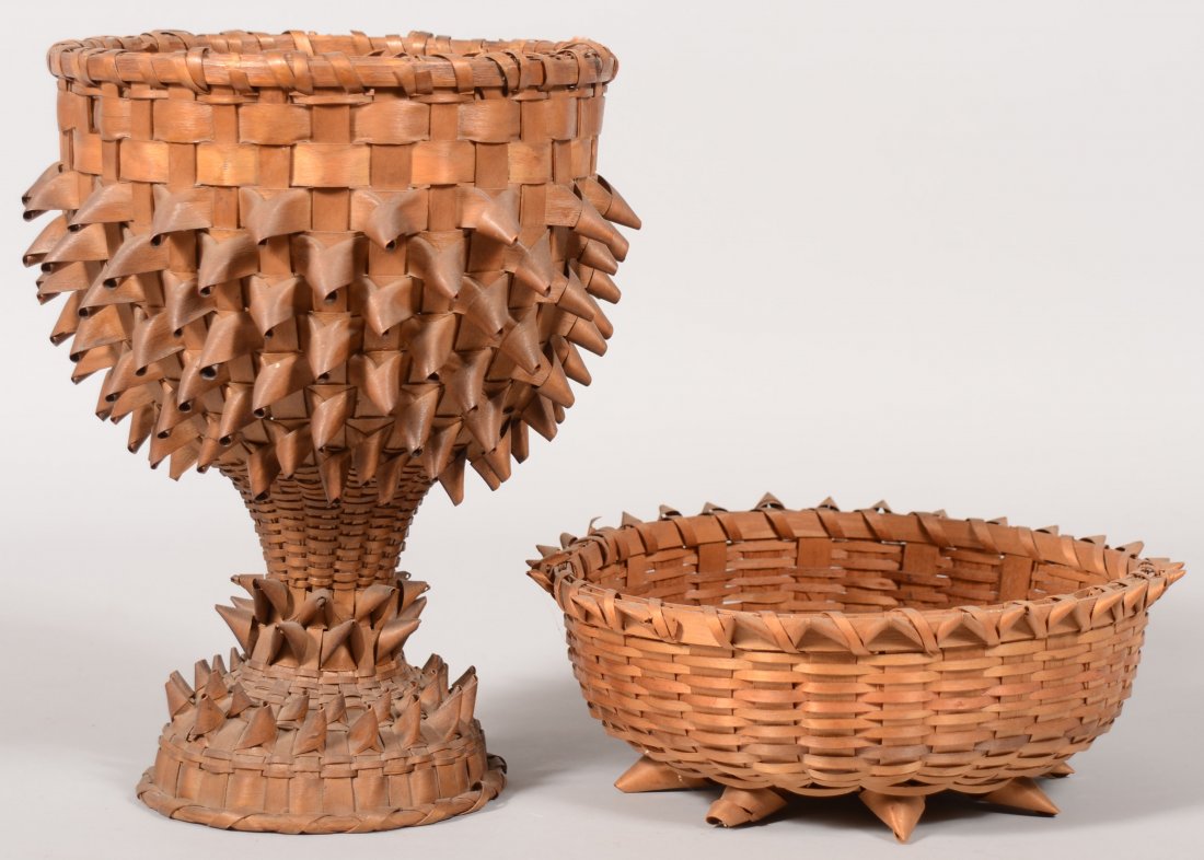 Two Baskets. A round open chalice shaped basket wi: Two Baskets. A round open chalice shaped basket with plaited wraps. Possibly Native American made. 12"h. X 8 1/2"dia. Along with another of similar make but low and open. 3 3/4"h. X 10"dia.