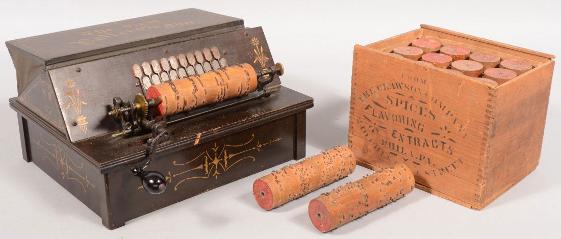 The Gem Roller Organ. Wooden hand cranked "cob" or: The Gem Roller Organ. Wooden hand cranked "cob" organ in shipping crate. Includes, crank and fifteen cob rolls. Patent date on organ 1887 and on rolls 1885. Dark walnut stained, gilt stenciled softwoo