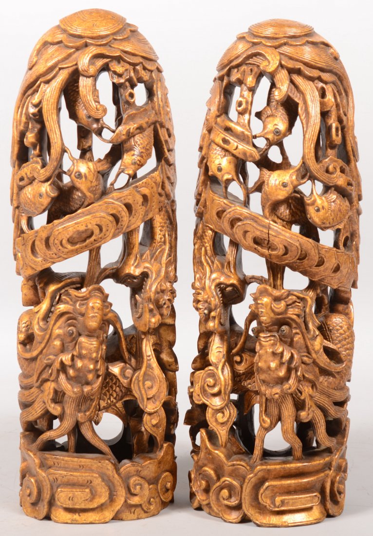Two Chinese Pierced Carved Wood Wall Pockets. Prof: Two Chinese Pierced Carved Wood Wall Pockets. Profusely carved and gilt covered wood vessels with dragons, fish and related Asian motifs. Both 18"h.