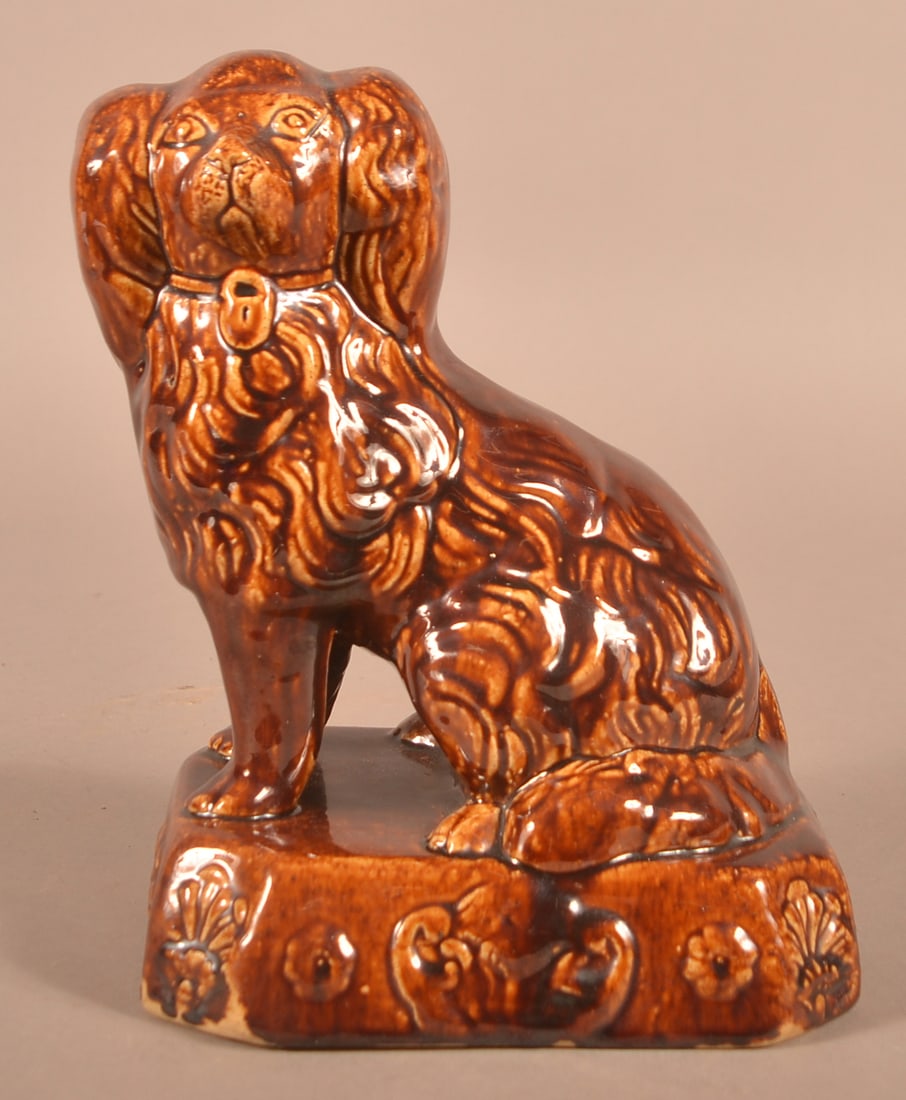 19th C. Rockingham Glazed Yellowware Seated Spaniel. (1 of 4)