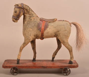 Antique German Felt Covered Horse Pull Toy.: Antique German Felt Covered Horse Pull Toy. Unsigned, all original. Wood platform base with metal wheels. 11-1/2"h. x 12-1/2"l.