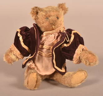 Antique German Brown Mohair Teddy Bear.: Antique German Brown Mohair Teddy Bear. Unsigned, attributed to Steiff, early 20th century. 5-way jointed with shoe button eyes and velvet jacket. Scarce size, 8-1/2"h.