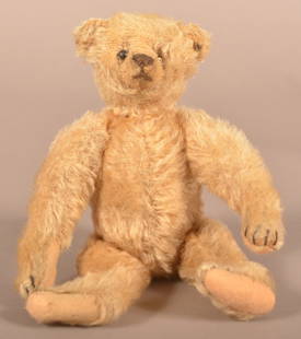 Antique Steiff Mohair Teddy Bear.: Antique Steiff Mohair Teddy Bear. With button, early 20th century. 5-way jointed with shoe button eyes. 10"h.