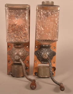 Two Wall-Mount Coffee Grinders.: Two Wall-Mount Coffee Grinders. With glass hoppers. The Jewel by Arcade Mfg. Co.,16"h., and the Queen by Brighton, 16"h.