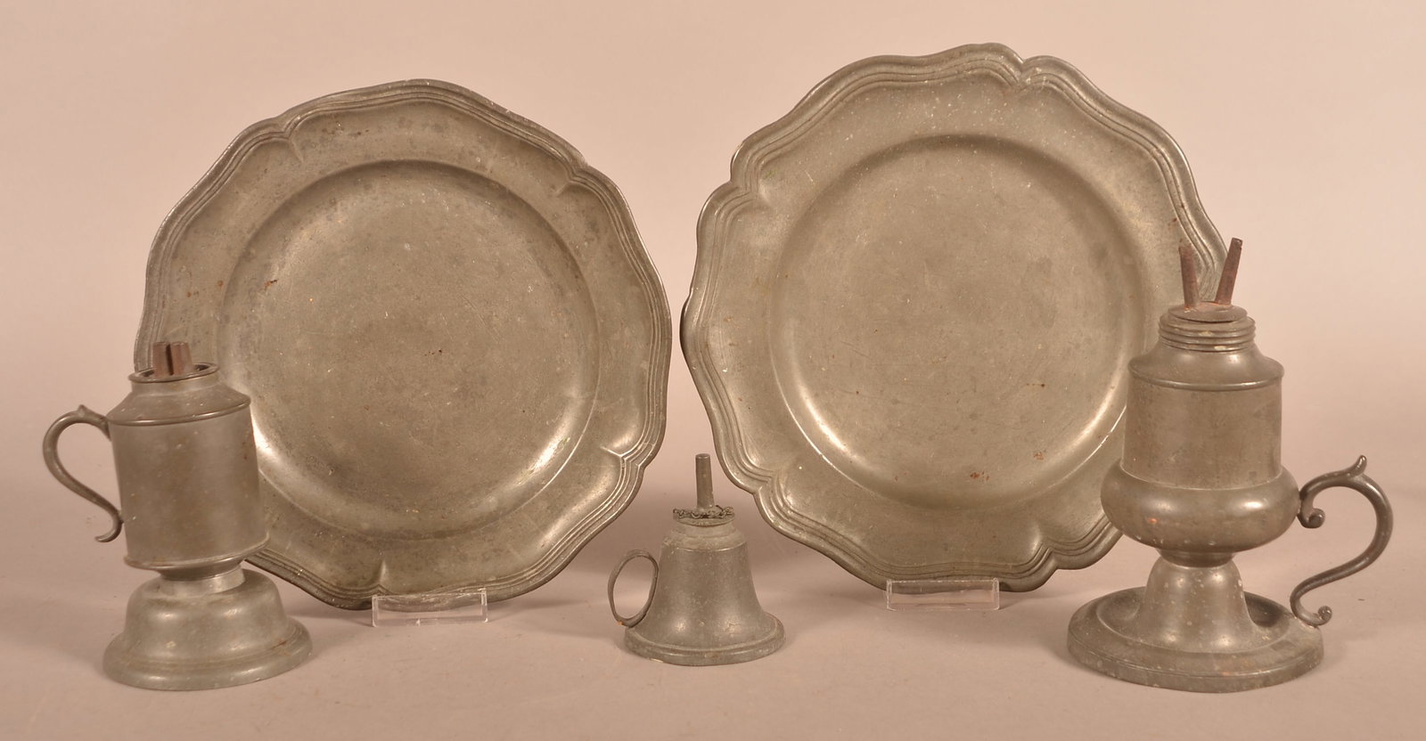 Five Pieces of Antique Pewter.: Five Pieces of Antique Pewter. Including three whale oil lamps, and two plates. Largest lamp, 7"h.