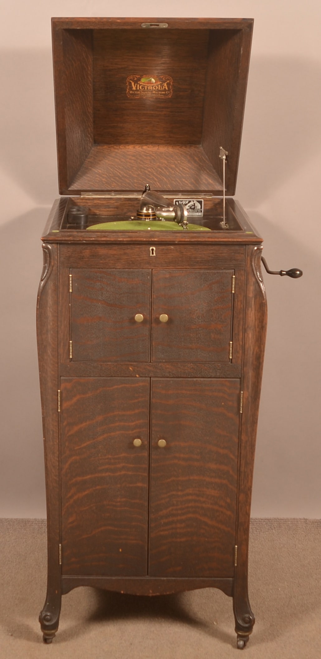 Victor Victrola VV-XI Oak Upright Record Player.: Victor Victrola VV-XI Oak Upright Record Player. SN-338318G.With records. 44-1/2"h. x 20"w. x 23"d.