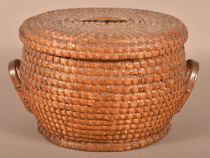 Large Antique PA Rye Straw Covered Coil Basket.: Large Antique PA Rye Straw Covered Coil Basket. Circular form, lid with open handle, applied bentwood side handles, coiled rimmed base. 11"h. x 18"diam.