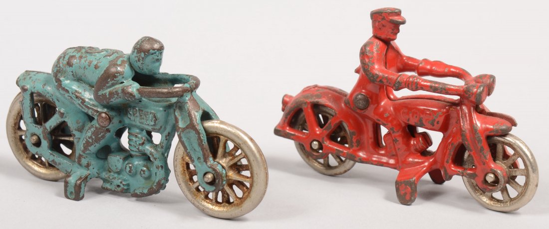 Two Small Painted Hubley Cast Iron Motorcycles. A b: Two Small Painted Hubley Cast Iron Motorcycles. A blue racer with nickel plated fourteen spoke wheels marked: "Speed" on tank and "Hubley" on exhaust pipe. 2 3/8"h. X 4 1/4"l. Along with a red "COP" m
